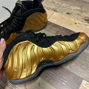 Nike Air Foamposite Gold and Black Sneakers